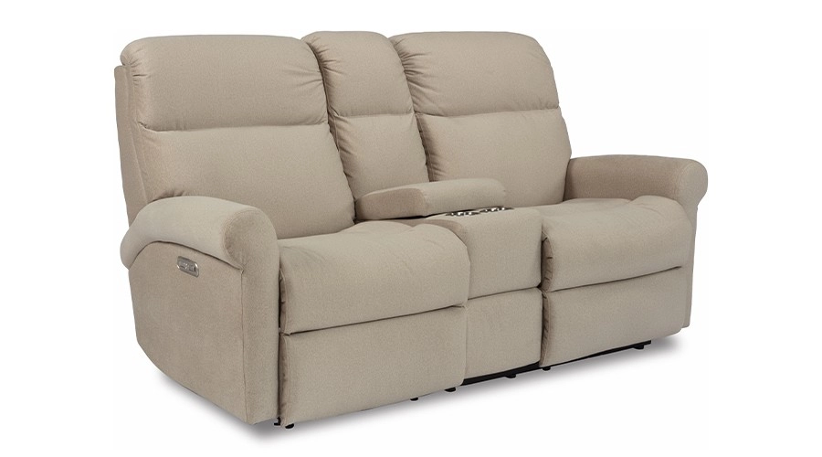 Tan reclining sofa with plush cushions and a center console featuring cup holders. The design conveys comfort and functionality.