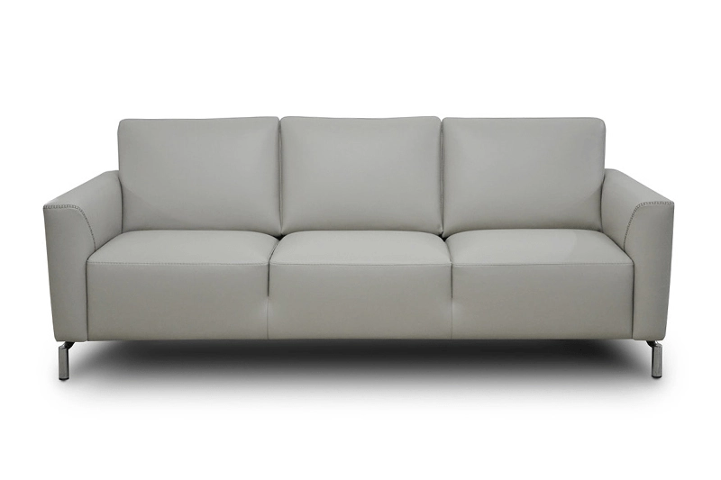 A modern, light gray leather sofa with three cushions and sleek metal legs. The design is minimalistic, conveying a sense of contemporary elegance.