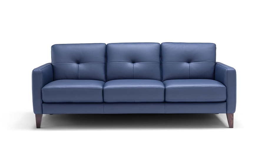 A sleek, modern navy blue leather sofa with three cushioned seats, tufted backrests, and wooden legs, positioned against a plain white background.