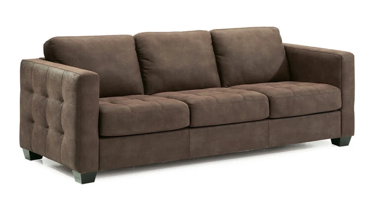 A brown, three-seater sofa with a plush, tufted design. It features wide armrests, dark wooden legs, and a modern, comfortable appearance.