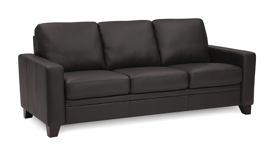 A sleek, modern dark brown leather sofa with three cushioned seats and wide armrests. The warm tone conveys comfort and style in a contemporary setting.