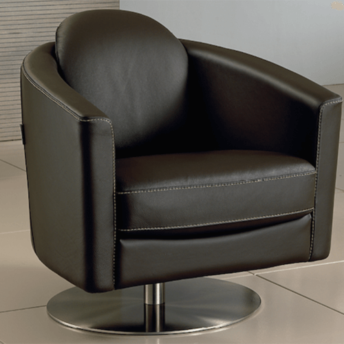 A sleek, modern black leather swivel chair with curved arms and white stitching sits on a tiled floor. The setting is minimalist and stylish.