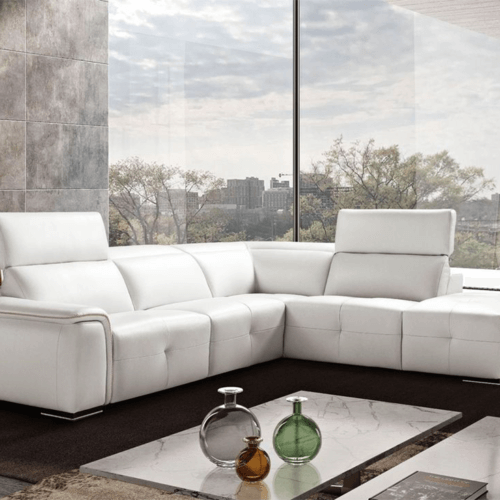 Brown leather recliner with padded armrests and backrest, exuding comfort and luxury. The chair has a sleek, modern design with a power control panel.